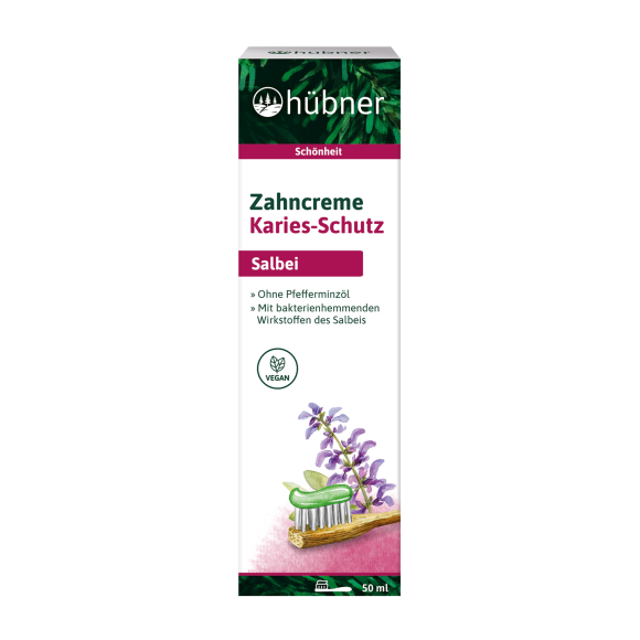 Eine Schachtel Hübner Salbei-Zahnpasta mit der Aufschrift „Karies-Schutz“ mit einer Salbei-Abbildung und einer Zahnbürste.
